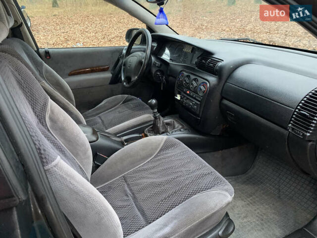 Зелений Опель Омега, об'ємом двигуна 2 л та пробігом 335 тис. км за 1550 $, фото 12 на Automoto.ua