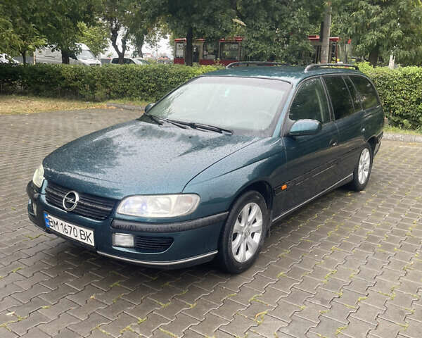 Зелений Опель Омега, об'ємом двигуна 2 л та пробігом 300 тис. км за 2100 $, фото 4 на Automoto.ua