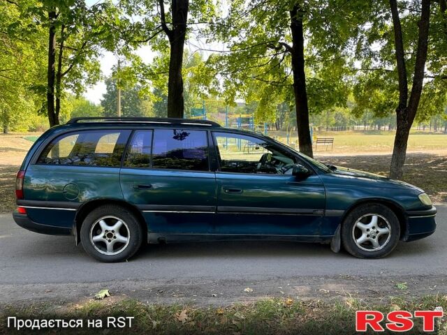 Зеленый Опель Омега, объемом двигателя 2.5 л и пробегом 263 тыс. км за 1400 $, фото 2 на Automoto.ua