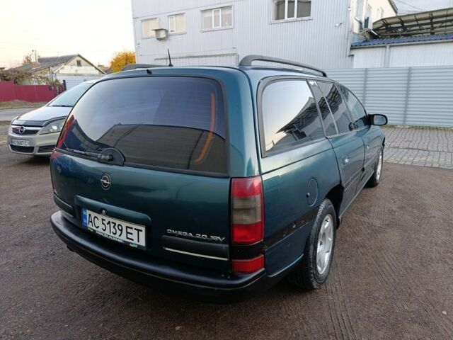 Зеленый Опель Омега, объемом двигателя 2 л и пробегом 327 тыс. км за 1050 $, фото 7 на Automoto.ua