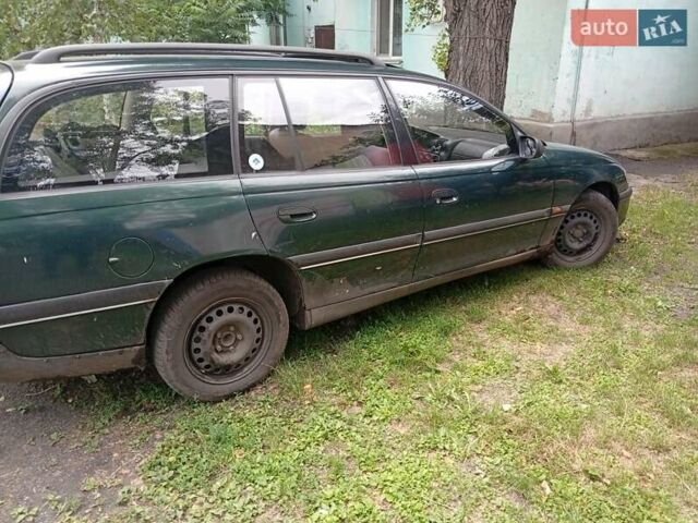 Зеленый Опель Омега, объемом двигателя 2 л и пробегом 200 тыс. км за 1900 $, фото 1 на Automoto.ua