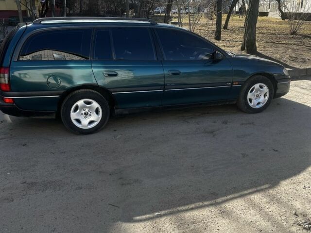 Зеленый Опель Омега, объемом двигателя 2.5 л и пробегом 265 тыс. км за 3000 $, фото 2 на Automoto.ua