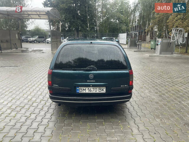 Зелений Опель Омега, об'ємом двигуна 2 л та пробігом 300 тис. км за 2100 $, фото 7 на Automoto.ua