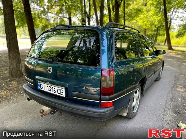 Зеленый Опель Омега, объемом двигателя 2.5 л и пробегом 263 тыс. км за 1400 $, фото 3 на Automoto.ua