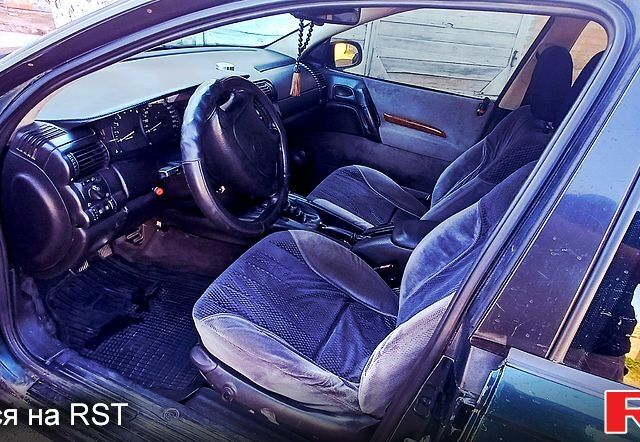 Зелений Опель Омега, об'ємом двигуна 2.5 л та пробігом 450 тис. км за 2000 $, фото 3 на Automoto.ua