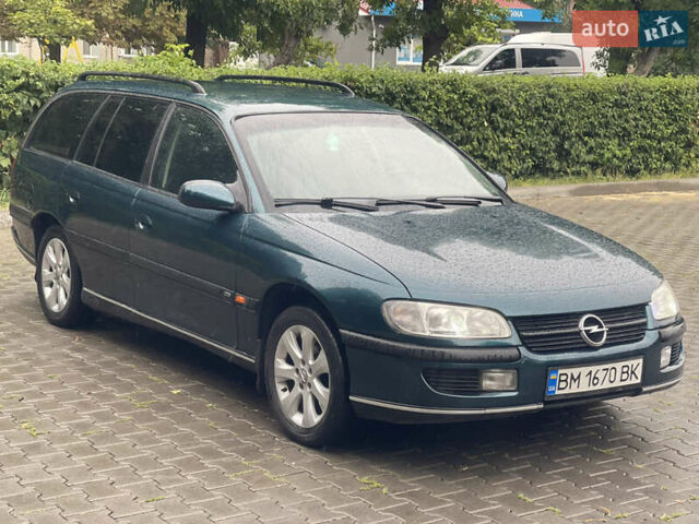 Зелений Опель Омега, об'ємом двигуна 2 л та пробігом 300 тис. км за 2100 $, фото 2 на Automoto.ua