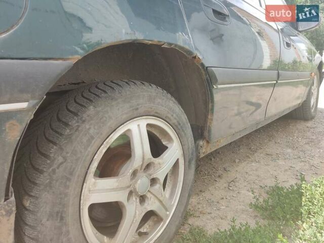 Опель Омега 1997 у Харкові на Automoto.ua Зелений Опель Омега, об'ємом двигуна 2 л та пробігом 308 тис. км за 1500 $, фото 13 на Automoto.ua