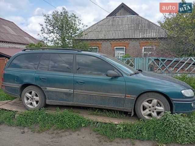 Зеленый Опель Омега, объемом двигателя 2 л и пробегом 330 тыс. км за 2400 $, фото 5 на Automoto.ua