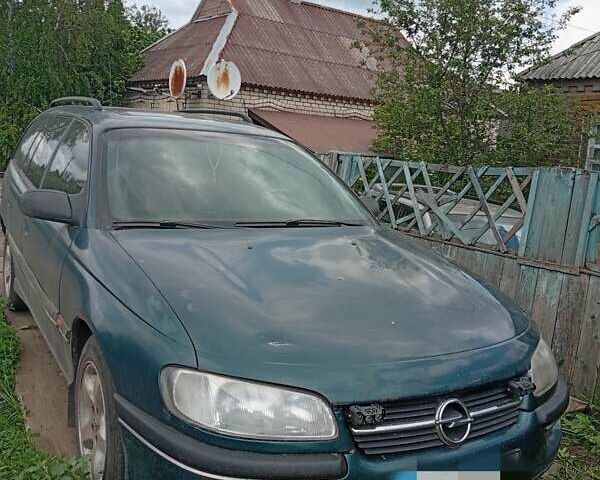 Зеленый Опель Омега, объемом двигателя 2 л и пробегом 330 тыс. км за 2400 $, фото 1 на Automoto.ua