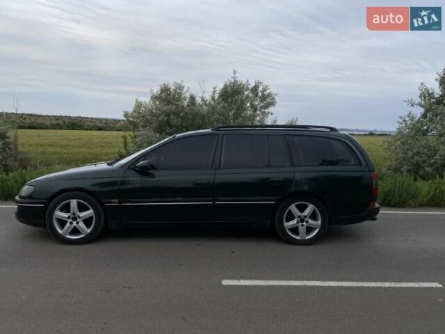 Зелений Опель Омега, об'ємом двигуна 2 л та пробігом 380 тис. км за 2210 $, фото 3 на Automoto.ua