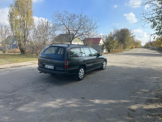 Зелений Опель Омега, об'ємом двигуна 2 л та пробігом 295 тис. км за 1300 $, фото 5 на Automoto.ua