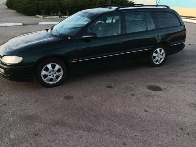 Зеленый Опель Омега, объемом двигателя 2 л и пробегом 352 тыс. км за 2200 $, фото 1 на Automoto.ua