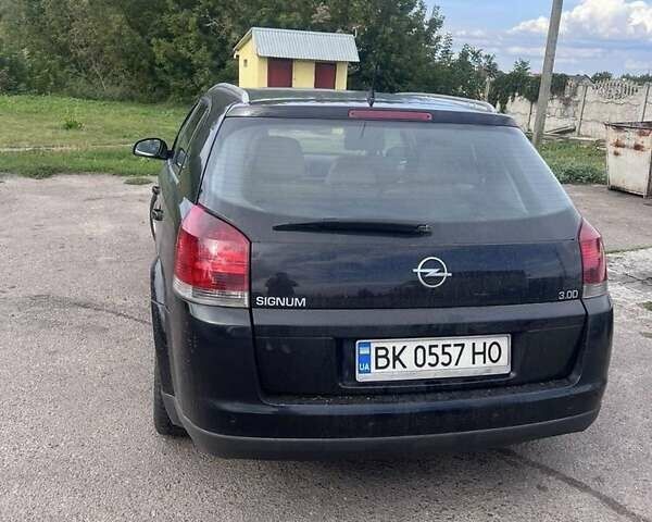 Черный Опель Сигнум, объемом двигателя 3 л и пробегом 230 тыс. км за 4500 $, фото 3 на Automoto.ua