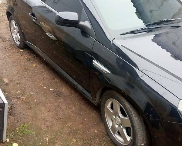 Черный Опель Тигра, объемом двигателя 1.4 л и пробегом 164 тыс. км за 5000 $, фото 1 на Automoto.ua