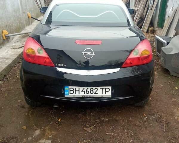 Черный Опель Тигра, объемом двигателя 1.4 л и пробегом 164 тыс. км за 5000 $, фото 3 на Automoto.ua