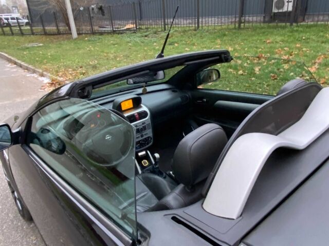 Черный Опель Тигра, объемом двигателя 1.8 л и пробегом 167 тыс. км за 5000 $, фото 8 на Automoto.ua