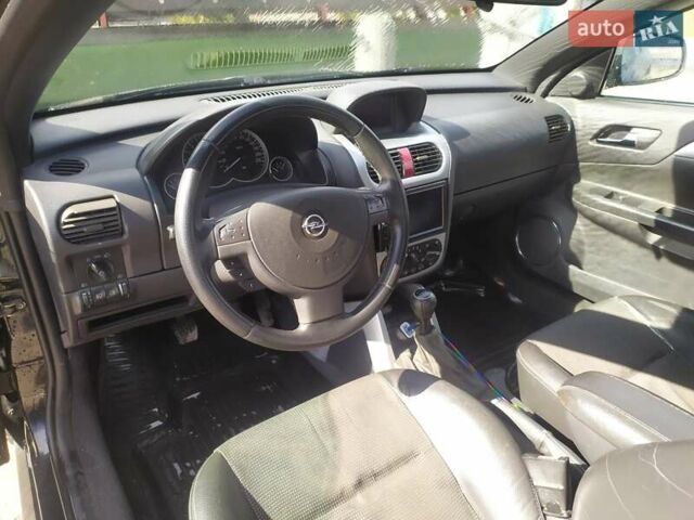 Черный Опель Тигра, объемом двигателя 1.8 л и пробегом 200 тыс. км за 5200 $, фото 5 на Automoto.ua