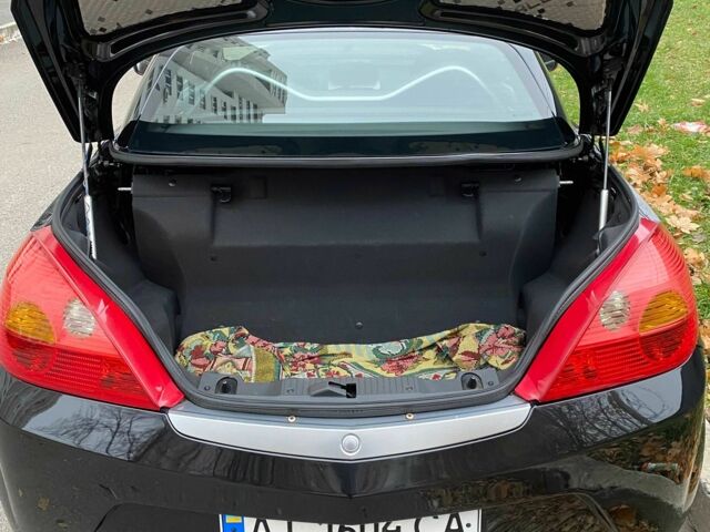 Черный Опель Тигра, объемом двигателя 1.8 л и пробегом 167 тыс. км за 5000 $, фото 6 на Automoto.ua