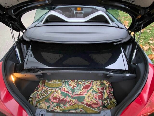 Черный Опель Тигра, объемом двигателя 1.8 л и пробегом 167 тыс. км за 5000 $, фото 9 на Automoto.ua