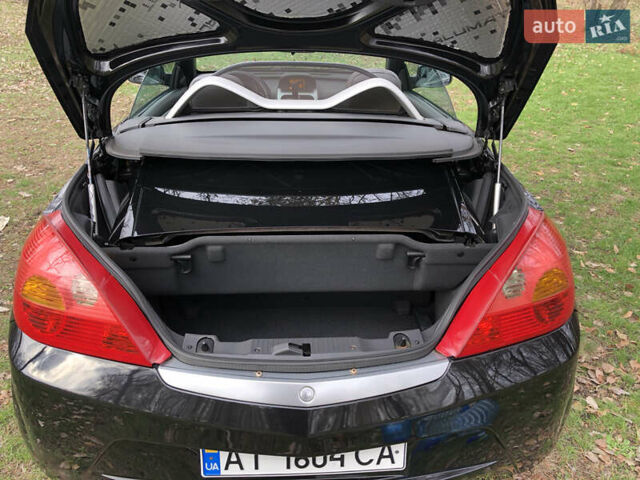 Чорний Опель Тігра, об'ємом двигуна 1.8 л та пробігом 160 тис. км за 5000 $, фото 9 на Automoto.ua