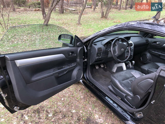 Чорний Опель Тігра, об'ємом двигуна 1.8 л та пробігом 160 тис. км за 5000 $, фото 6 на Automoto.ua