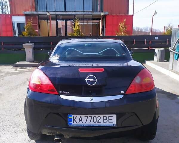 Черный Опель Тигра, объемом двигателя 1.8 л и пробегом 200 тыс. км за 5200 $, фото 3 на Automoto.ua