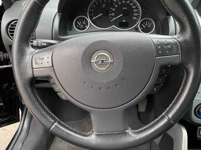 Черный Опель Тигра, объемом двигателя 1.8 л и пробегом 167 тыс. км за 5000 $, фото 14 на Automoto.ua