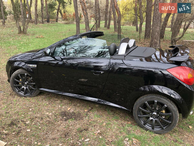 Чорний Опель Тігра, об'ємом двигуна 1.8 л та пробігом 160 тис. км за 5000 $, фото 5 на Automoto.ua
