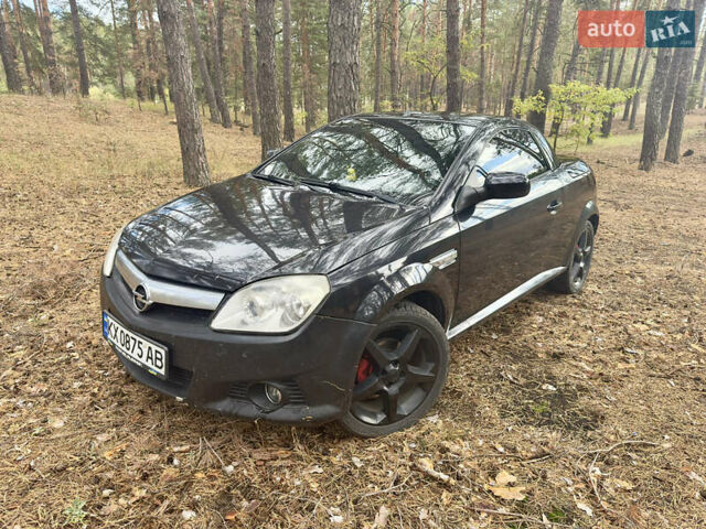 Черный Опель Тигра, объемом двигателя 1.25 л и пробегом 185 тыс. км за 3999 $, фото 8 на Automoto.ua