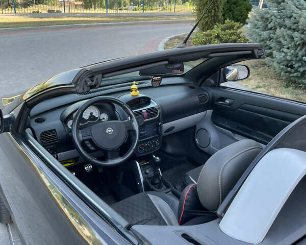 Чорний Опель Тігра, об'ємом двигуна 1.25 л та пробігом 180 тис. км за 3900 $, фото 9 на Automoto.ua