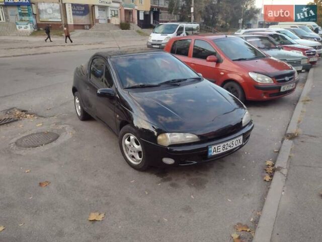 Чорний Опель Тігра, об'ємом двигуна 1.4 л та пробігом 260 тис. км за 2000 $, фото 8 на Automoto.ua