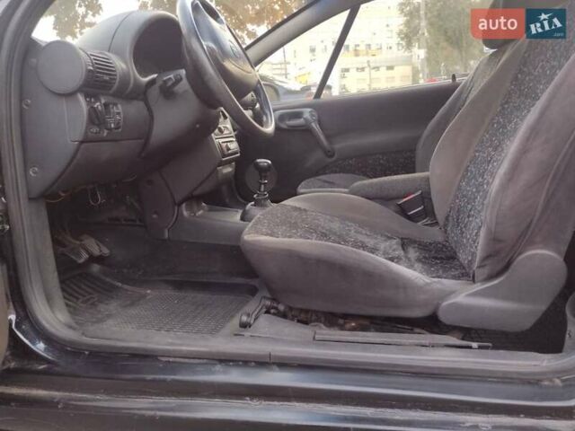 Чорний Опель Тігра, об'ємом двигуна 1.4 л та пробігом 260 тис. км за 2000 $, фото 13 на Automoto.ua