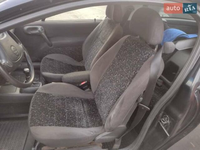 Чорний Опель Тігра, об'ємом двигуна 1.4 л та пробігом 260 тис. км за 2000 $, фото 18 на Automoto.ua