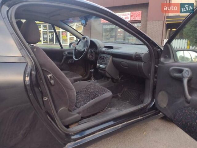 Чорний Опель Тігра, об'ємом двигуна 1.4 л та пробігом 260 тис. км за 2000 $, фото 17 на Automoto.ua