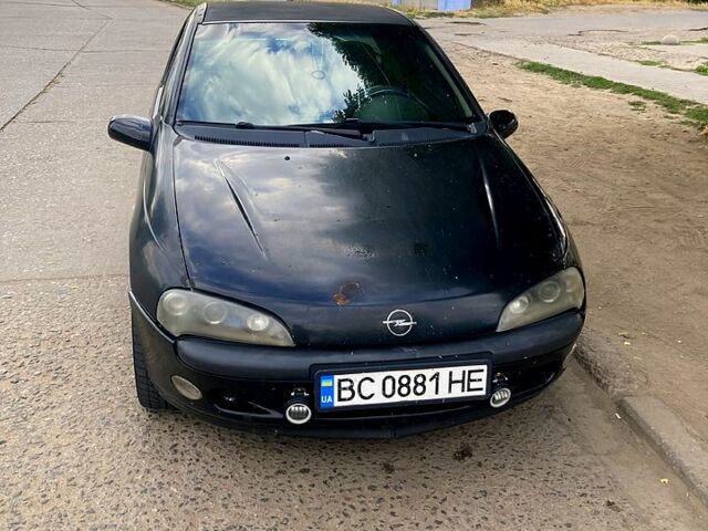 Черный Опель Тигра, объемом двигателя 1.4 л и пробегом 200 тыс. км за 1750 $, фото 1 на Automoto.ua