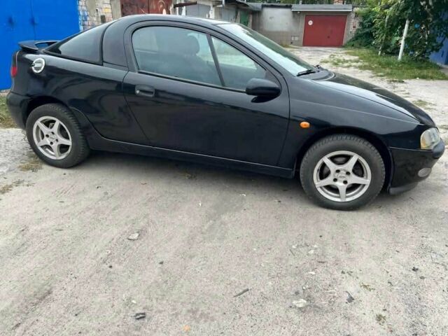 Чорний Опель Тігра, об'ємом двигуна 0 л та пробігом 240 тис. км за 2019 $, фото 1 на Automoto.ua