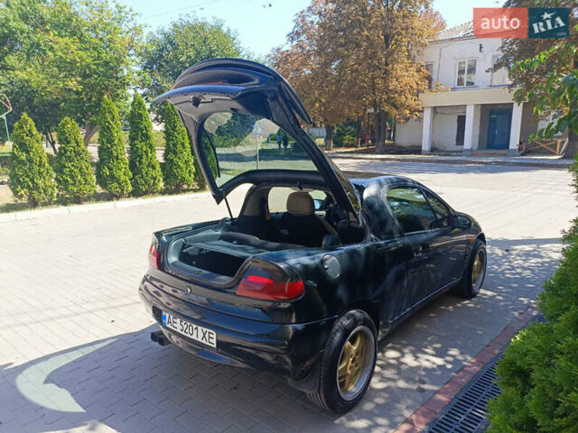 Черный Опель Тигра, объемом двигателя 1.4 л и пробегом 229 тыс. км за 3300 $, фото 2 на Automoto.ua