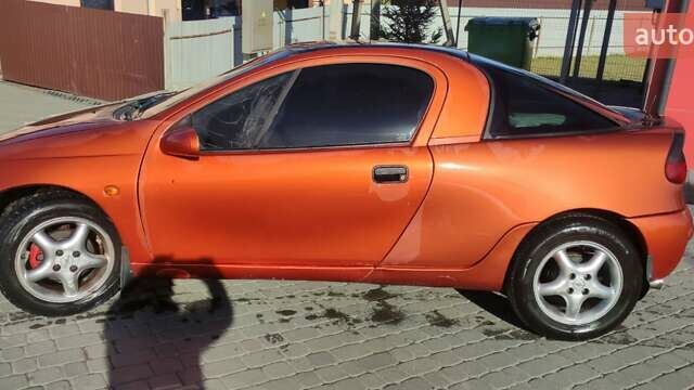 Коричневый Опель Тигра, объемом двигателя 1.39 л и пробегом 194 тыс. км за 1500 $, фото 6 на Automoto.ua