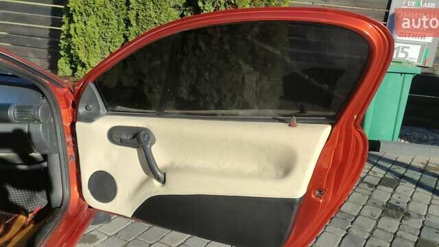 Коричневый Опель Тигра, объемом двигателя 1.39 л и пробегом 194 тыс. км за 1500 $, фото 5 на Automoto.ua