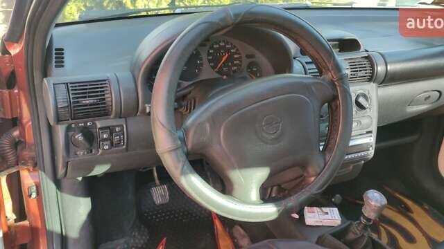 Коричневый Опель Тигра, объемом двигателя 1.39 л и пробегом 194 тыс. км за 1500 $, фото 2 на Automoto.ua