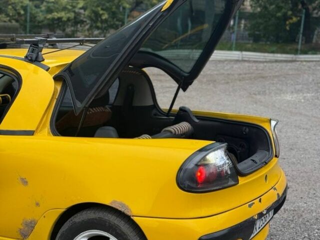 Желтый Опель Тигра, объемом двигателя 1.4 л и пробегом 180 тыс. км за 1350 $, фото 8 на Automoto.ua