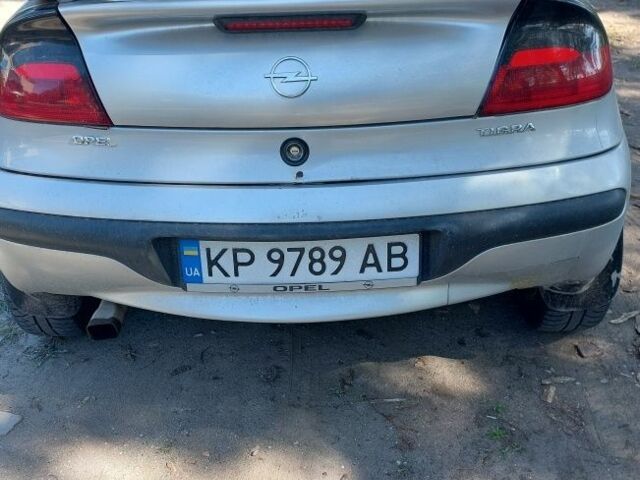 Серый Опель Тигра, объемом двигателя 1.6 л и пробегом 158 тыс. км за 2600 $, фото 4 на Automoto.ua