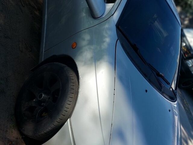 Серый Опель Тигра, объемом двигателя 1.6 л и пробегом 158 тыс. км за 2600 $, фото 2 на Automoto.ua