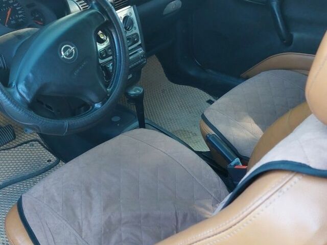 Серый Опель Тигра, объемом двигателя 1.6 л и пробегом 158 тыс. км за 2600 $, фото 6 на Automoto.ua