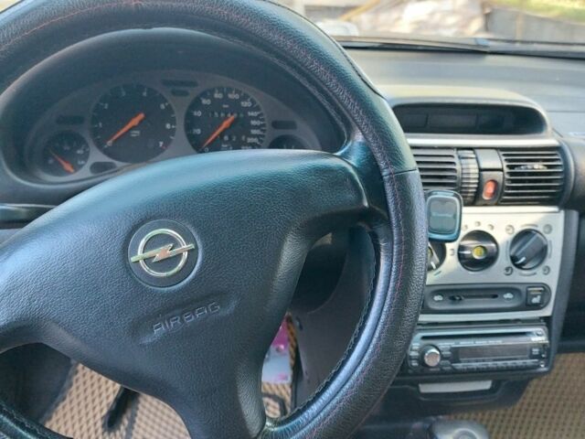 Серый Опель Тигра, объемом двигателя 1.6 л и пробегом 158 тыс. км за 2600 $, фото 5 на Automoto.ua