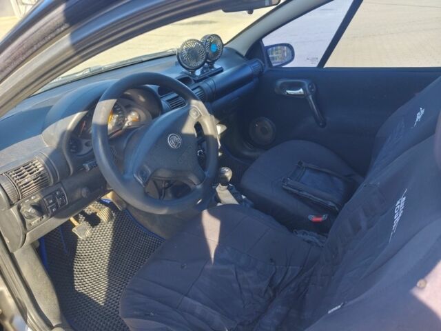 Сірий Опель Тігра, об'ємом двигуна 1.4 л та пробігом 240 тис. км за 2500 $, фото 5 на Automoto.ua