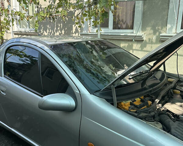 Серый Опель Тигра, объемом двигателя 1.4 л и пробегом 188 тыс. км за 2800 $, фото 9 на Automoto.ua