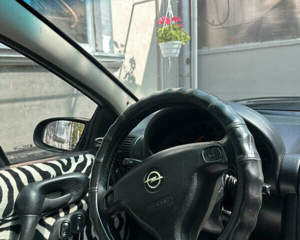 Серый Опель Тигра, объемом двигателя 1.4 л и пробегом 188 тыс. км за 2800 $, фото 5 на Automoto.ua