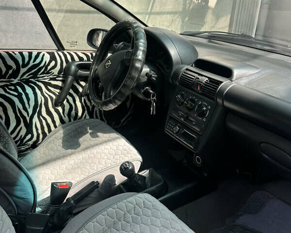 Серый Опель Тигра, объемом двигателя 1.4 л и пробегом 188 тыс. км за 2800 $, фото 3 на Automoto.ua