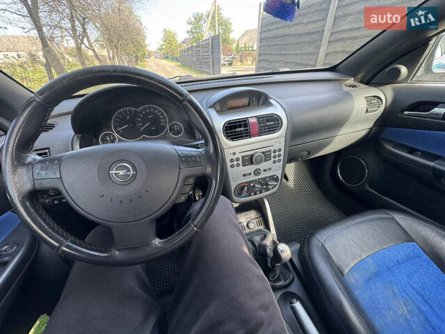 Синий Опель Тигра, объемом двигателя 1.39 л и пробегом 200 тыс. км за 4300 $, фото 27 на Automoto.ua